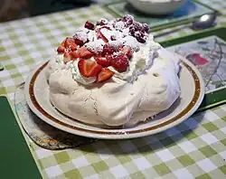 Image 53Pavlova, a popular New Zealand dessert, garnished with cream and strawberries (from Culture of New Zealand)
