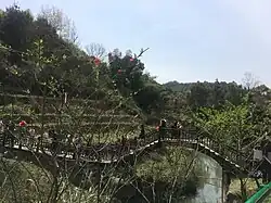 A bridge over a stream in Peace Valley of Mount Dongwu in Huitang Town.