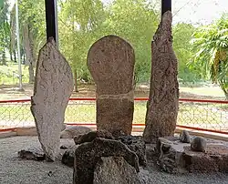 Three standing stones among smaller rocks
