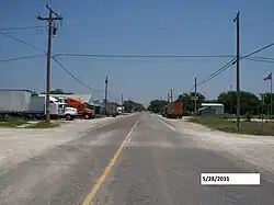 In front of Mark Street on FM 2210, looking east