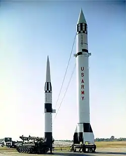 Pershing missile next to Redstone missile illustrating the difference in height and range.