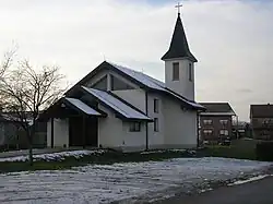 A white church with a steeple.