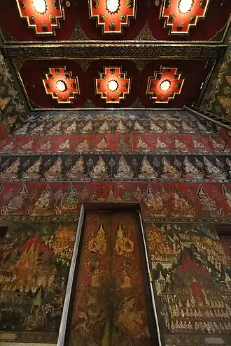 Door panels depicting guardian figures inside the Phutthaisawan Throne Hall