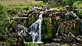 a view of a picnic above the upper cascade of the Loup of Fintry waterfalls