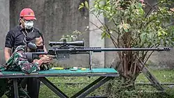 An Indonesian Army soldier sight in on an SPR-2 caliber .50 BMG anti-materiel rifle in September 2021.