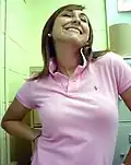 Image 68Woman wearing a polo shirt with a popped collar. (from 1990s in fashion)