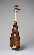 Pipa with carved and inlaid decoration, Qing dynasty. Metropolitan Museum of Art.