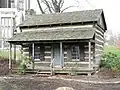 Log Cabin from the 1800s that was placed on the grounds of the Cathedral of Learning facing Forbes Avenue to celebrate Pitt's bicentennial (1987) and log cabin origins.