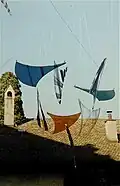 Pléiades (1977), outdoor mobile sculpture made of plexiglass and perlon thread. Exhibited in various international shows and referenced in several publications.