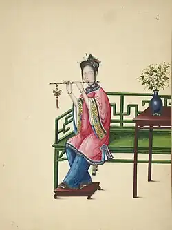 Woman playing a dizi.