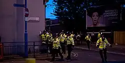 Met Police officers in Croydon during the England Riots in 2011, chin straps are utilised in the event of mass disorder