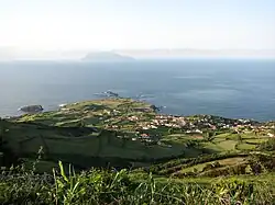 View of Ponta Delgada das Flores, with the distant island of Corvo