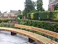 Pope's Urn benches, with St Mary's Church, Twickenham, in the background