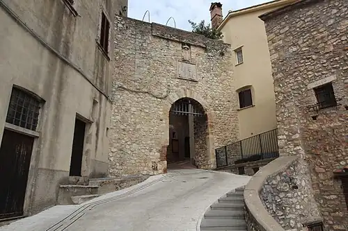 Porta Romana, with stone arch and inscription above the entrance