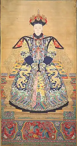 Portrait of an empress, possibly Empress Xiaoxianchun, (wife of the Qianlong Emperor) sitting on a chair decorated with fenghuang