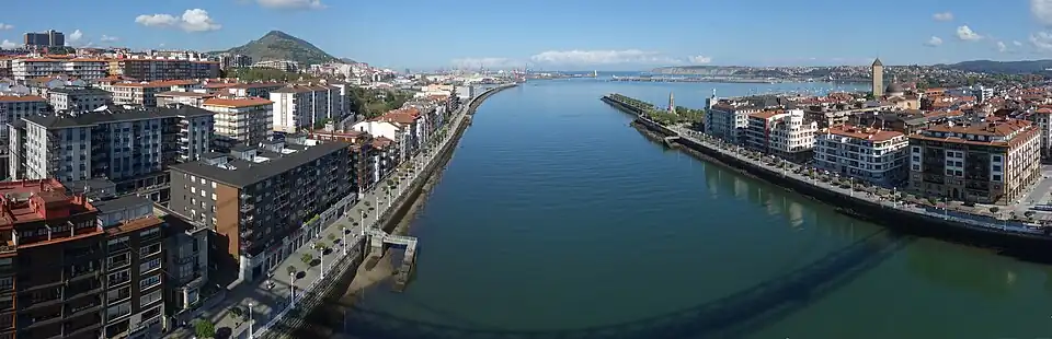 Looking north, from the bridge, Portugalete to the left, the Estuary of Bilbao, and Las Arenas