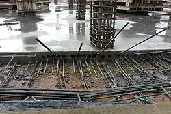 after removal of forms, tendons visible emerging from ducts