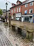 The fish stones, whipping post and (in the background) the Masonic Hall