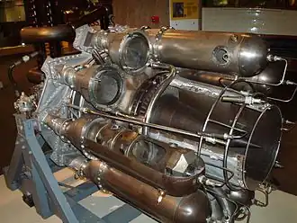Power Jets W.2 for its initial installation in the Gloster E28/39 was tested with no diffusion from the turbine exit Mn of 0.8. The turbine blade annulus area was used for the length of pipe necessary to reach the tail of the aircraft. The exhaust reached the speed of sound at a low thrust but at the turbine temperature limit due to the excessive pressure loss and frictional heating. Diffusion was added behind the turbine with the cone shown to reduce the pipe entry Mach number.[108]