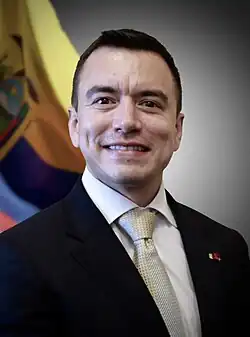 Headshot of Daniel Noboa. He is a clean-shaven, Latino man with very short hair, wearing a suit with a tie.