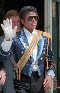 Jackson wearing sunglasses while waving