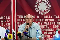Marek Lieberberg sits and speaks into a microphone