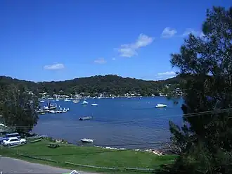 Araluen Drive, featuring the bay and wharf. Directly opposite is Wagstaffe.