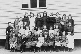 Pupils of the Blackbutt State School with their teacher, circa 1912