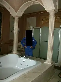 A multi-person jacuzzi in one of the residence's bedrooms