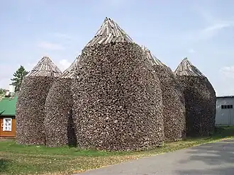 Firewood stacks at Pühtitsa Convent in Estonia are about 6 metres (20&nbsp;ft) high.