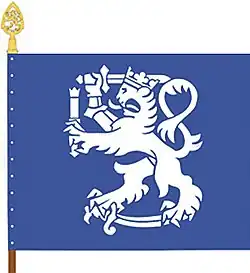 The colour of the Finnish Defence Forces International Centre features a Lion of Finland holding a herald's staff in addition to a sword. The shade of blue is the same as in the flag of the United Nations.[13]: 58 