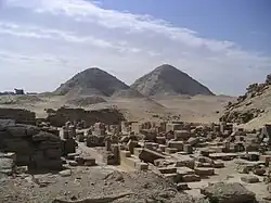 A photograph of two pyramids