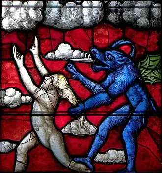 Part of stained glass in the Chapelle Notre-Dame de Kergoat. An angel is chased by a demon.
