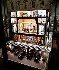 A large, illuminated dollhouse