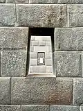 Original trapezoid windows inside the temple