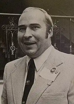 Black-and-white photograph of Dwyer smiling