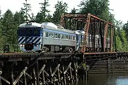 The Lewis and Clark Explorer, made up of three Budd Rail Diesel Cars, crosses a bridge at Blind Slough on July 5th, 2005
