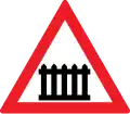 Level crossing with a railway with barriers