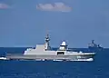 RSS Intrepid and USS Harpers Ferry transits in the background during maneuvers in the Singapore phase of Cooperation Afloat Readiness and Training (CARAT) 2009.