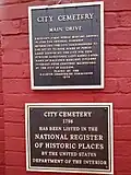 Plaques in front of the cemetery