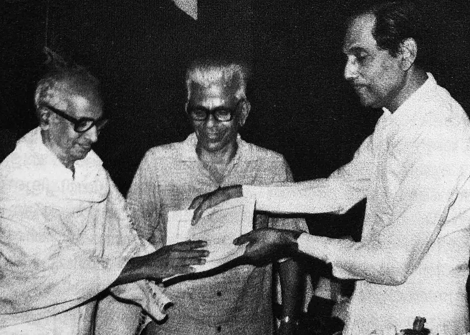 Receiving the Changapuzha Award from Justice Shankaran Nair, alongside Akkitham.
