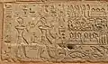 Relief from the Red Chapel showing Thutmose III behind Hatshepsut while both are wearing the Khepresh and making offering to the gods.