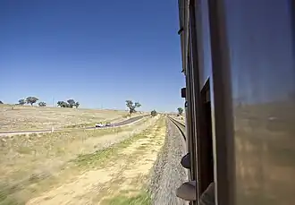Junee-Harefield Road at Harefield viewed from a CPH railmotor on the Main southern railway line
