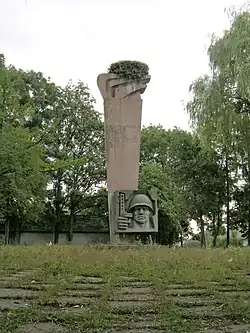 Memorial sign to fellow countrymen who died during World War II in the village of Ripyntsi, Buchach district, Ternopil region (2007)
