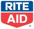 The words "Rite" and "Aid" written in white, all-capitals text, inside of a pentagon. The top half of the pentagon, containing the word "Rite", is blue, while the bottom half, containing the word "Aid", is red.
