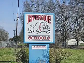 Sign for the Riverside schools campus of the Western Line School District, which includes Riverside Elementary School and Riverside High School