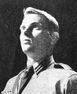 Black and white close up shot of Lloyd in Nazi garb