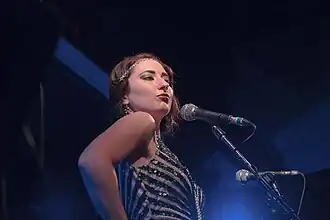 Anderson performing on stage with Postmodern Jukebox