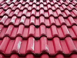 Interlocking tile designed to look like pantile