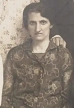Rosa Dubovsky, wearing short dark hair and a flower patterned dress